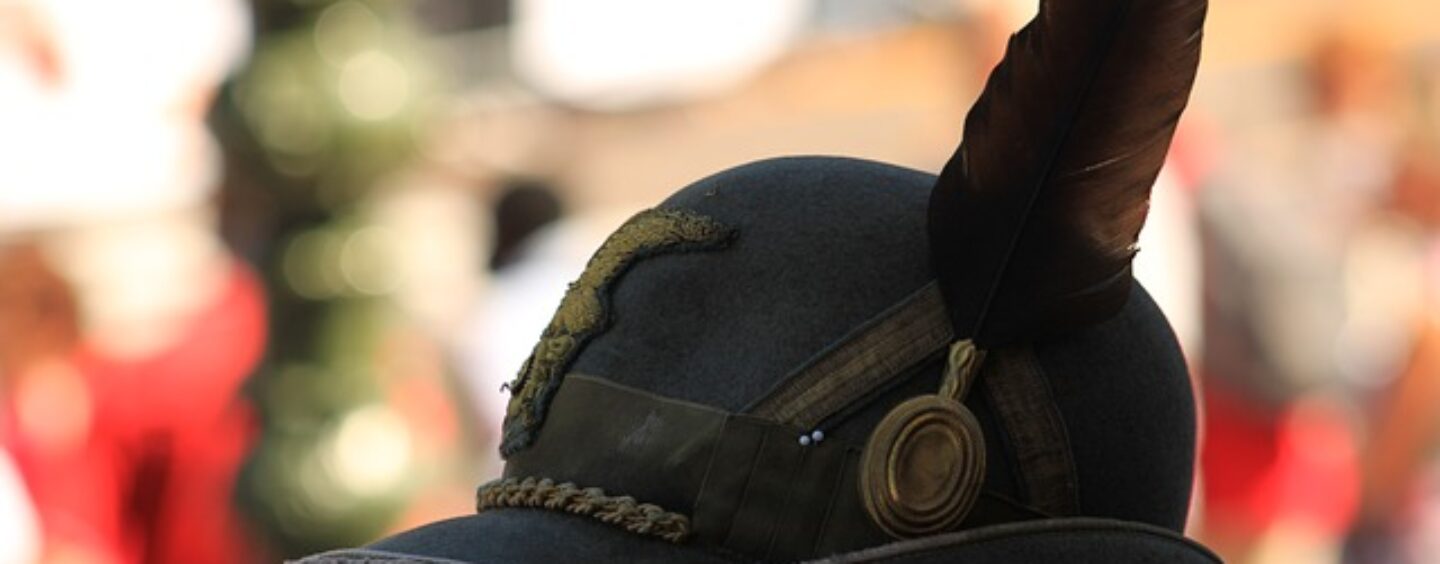 Disegna una medaglia e il logo per gli alpini di Vadobbiadene